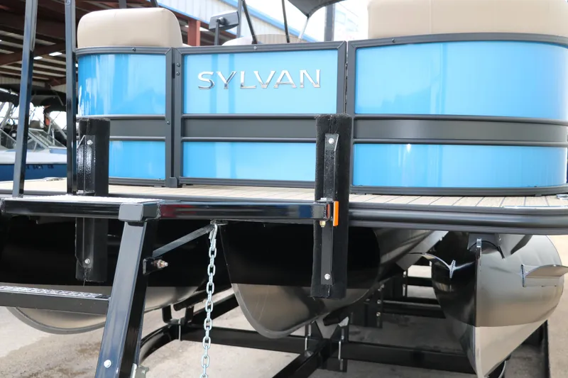 Slide: The Image of 2025 Sylvan Mirage X3 CLZ DH pontoon boat with blue exterior and black trim. - 9