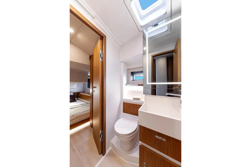 Slide: The Image of Luxurious bathroom interior of 2026 Moody 48 Deck Saloon yacht, featuring modern fixtures and wood accents. - 30
