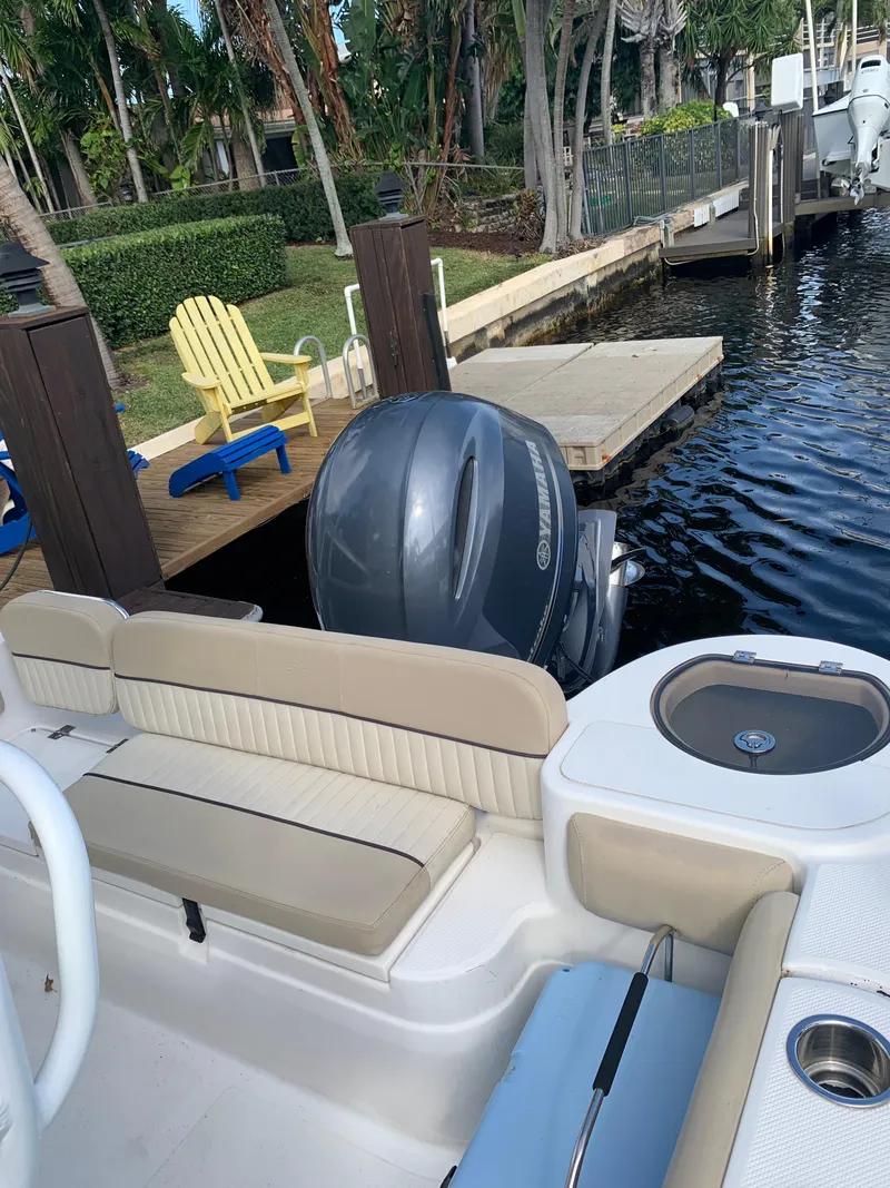Slide: The Image of 2017 Sea Fox 226 Commander boat docked by a pier with a Yamaha outboard motor. - 13