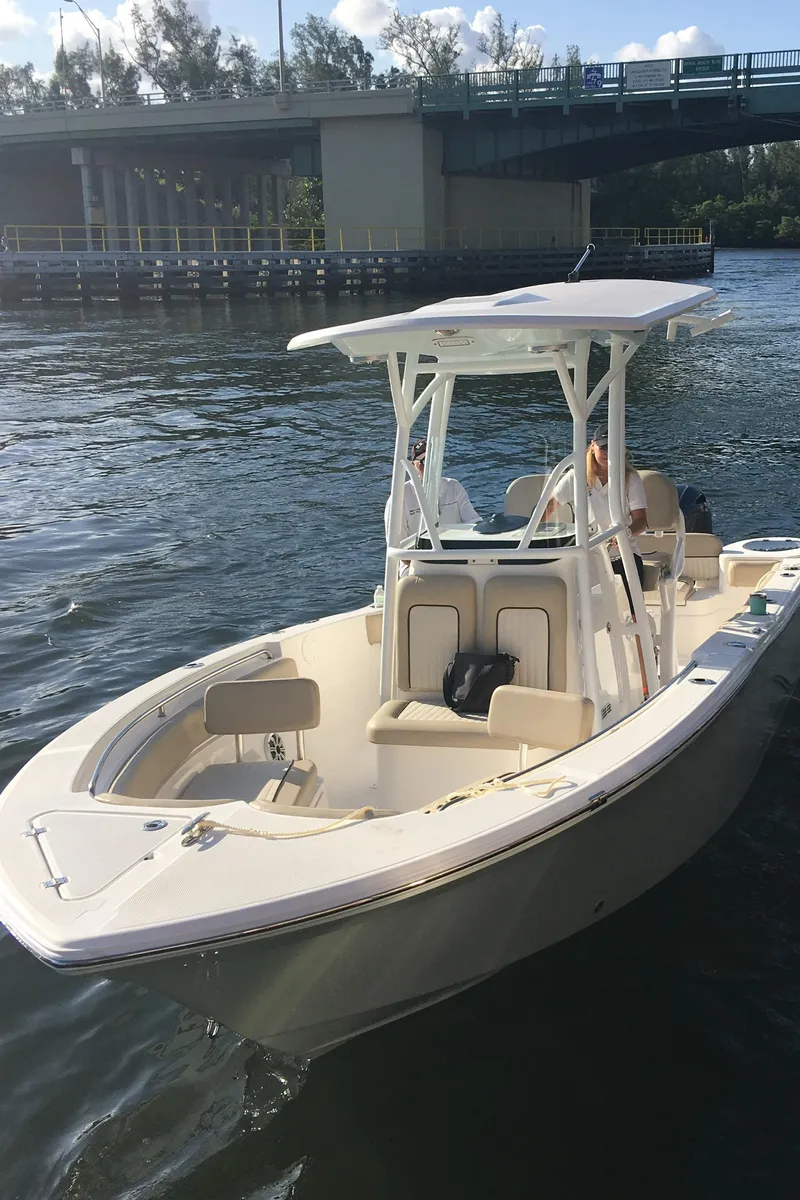 Slide: The Image of 2017 Sea Fox 226 Commander boat on water near a bridge. - 2