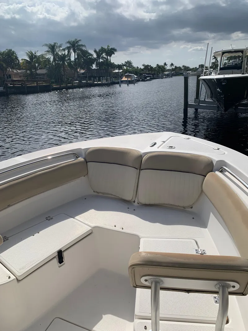 Slide: The Image of 2017 Sea Fox 226 Commander boat on a calm waterway with palm trees. - 4