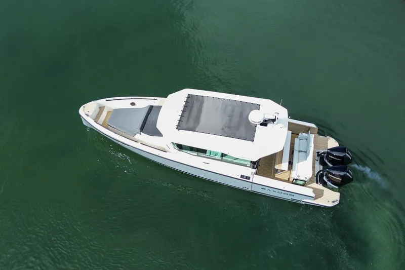 Slide: The Image of Aerial view of 2026 Saxdor 320 GTC boat cruising on calm water. - 31