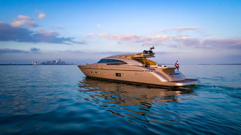 Slide: The Image of Luxurious AB 118 yacht from 2010 cruising on calm waters at sunset. - 20