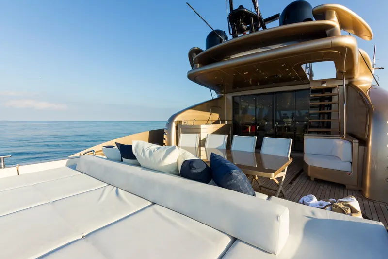 Slide: The Image of Luxurious AB 118 yacht deck with seating, ocean view, and clear blue sky. - 22