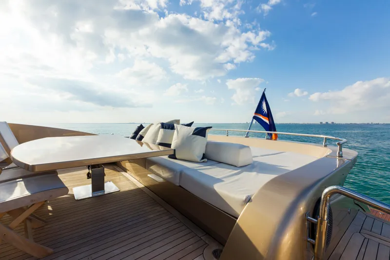 Slide: The Image of Luxurious AB 118 yacht deck with seating, table, and ocean view under a blue sky. - 31