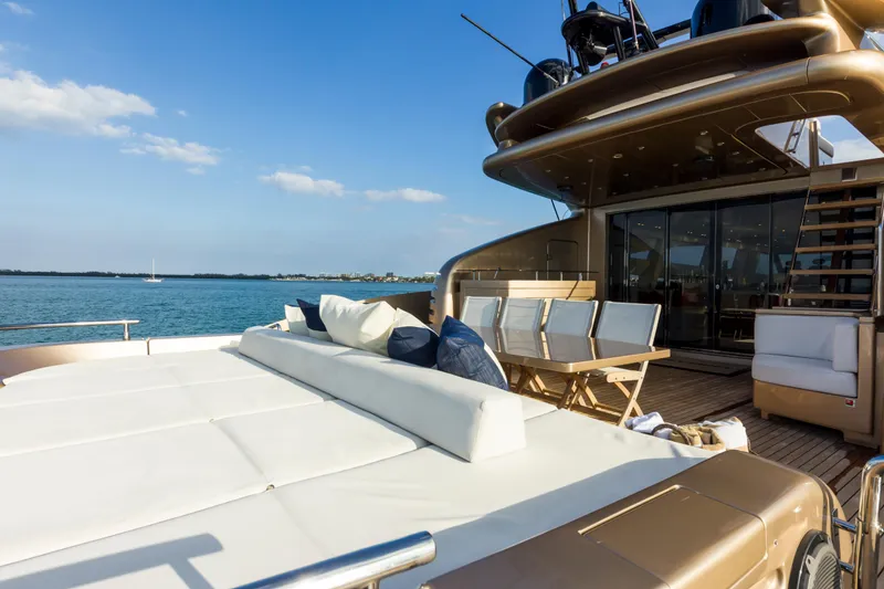 Slide: The Image of Luxurious AB 118 yacht deck with seating, ocean view, and clear blue sky, 2010 model. - 32