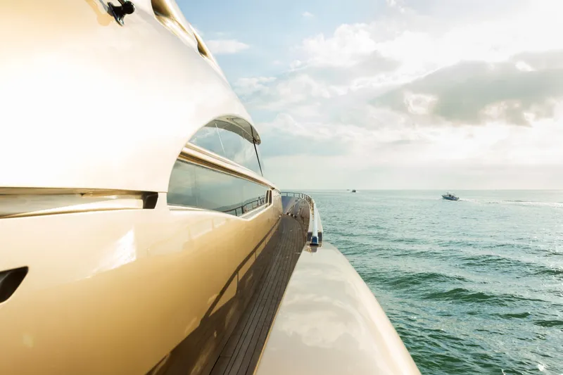 Slide: The Image of Luxurious AB 118 yacht cruising on open sea under a bright sky, 2010 model. - 37
