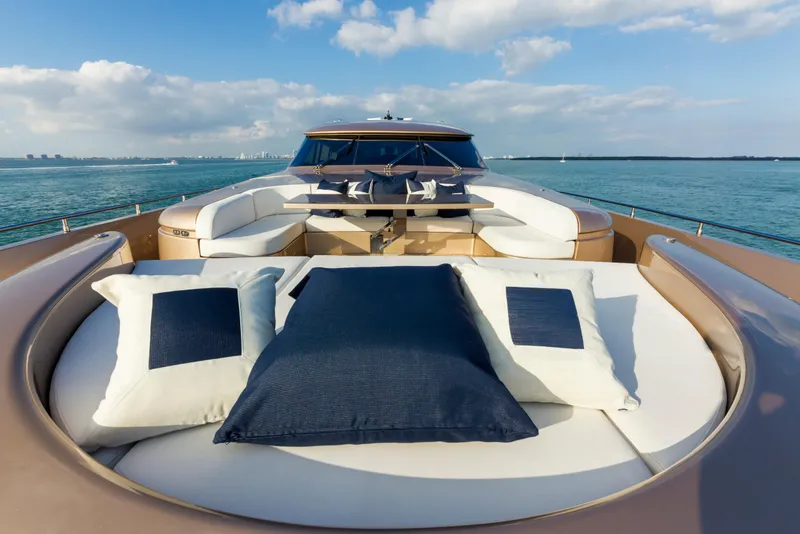 Slide: The Image of Luxurious AB 118 yacht deck with cushions, ocean view, and clear skies, 2010 model. - 40