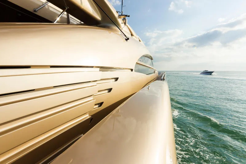 Slide: The Image of Luxurious AB 118 yacht cruising on the ocean, 2010 model, with another boat in the distance. - 46