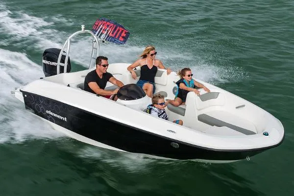 Slide: The Image of 2024 Bayliner E16 Limited Edition boat cruising with family on the water. - 2
