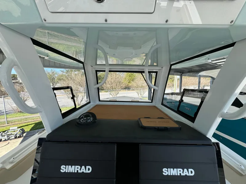Slide: The Image of 2024 Sea Pro 322 Offshore helm with dual Simrad displays. - 15