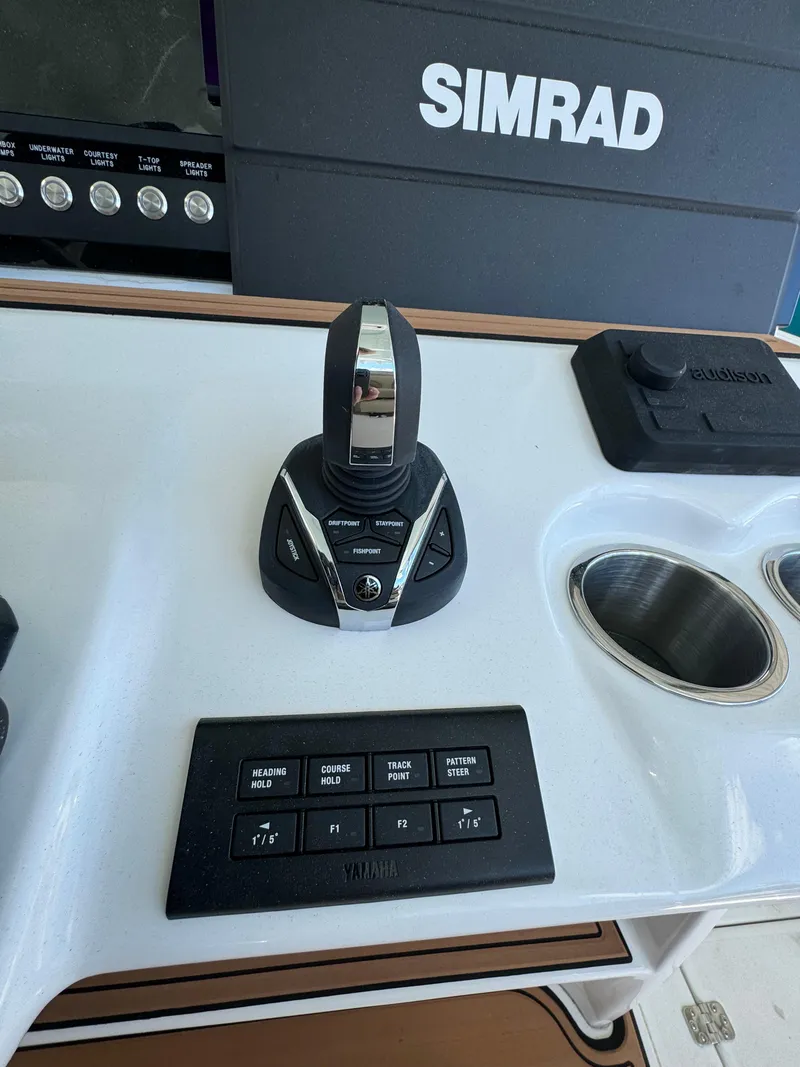 Slide: The Image of 2024 Sea Pro 322 Offshore boat control panel with Simrad electronics. - 20