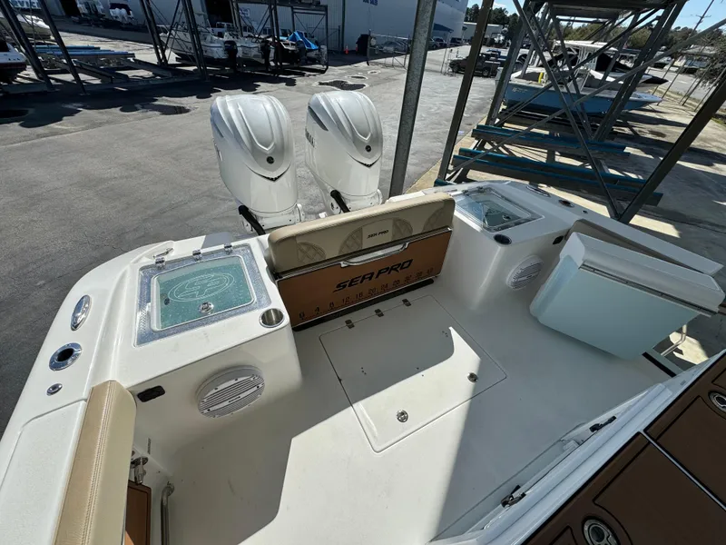 Slide: The Image of 2024 Sea Pro 322 Offshore boat with dual outboard motors and spacious deck. - 21