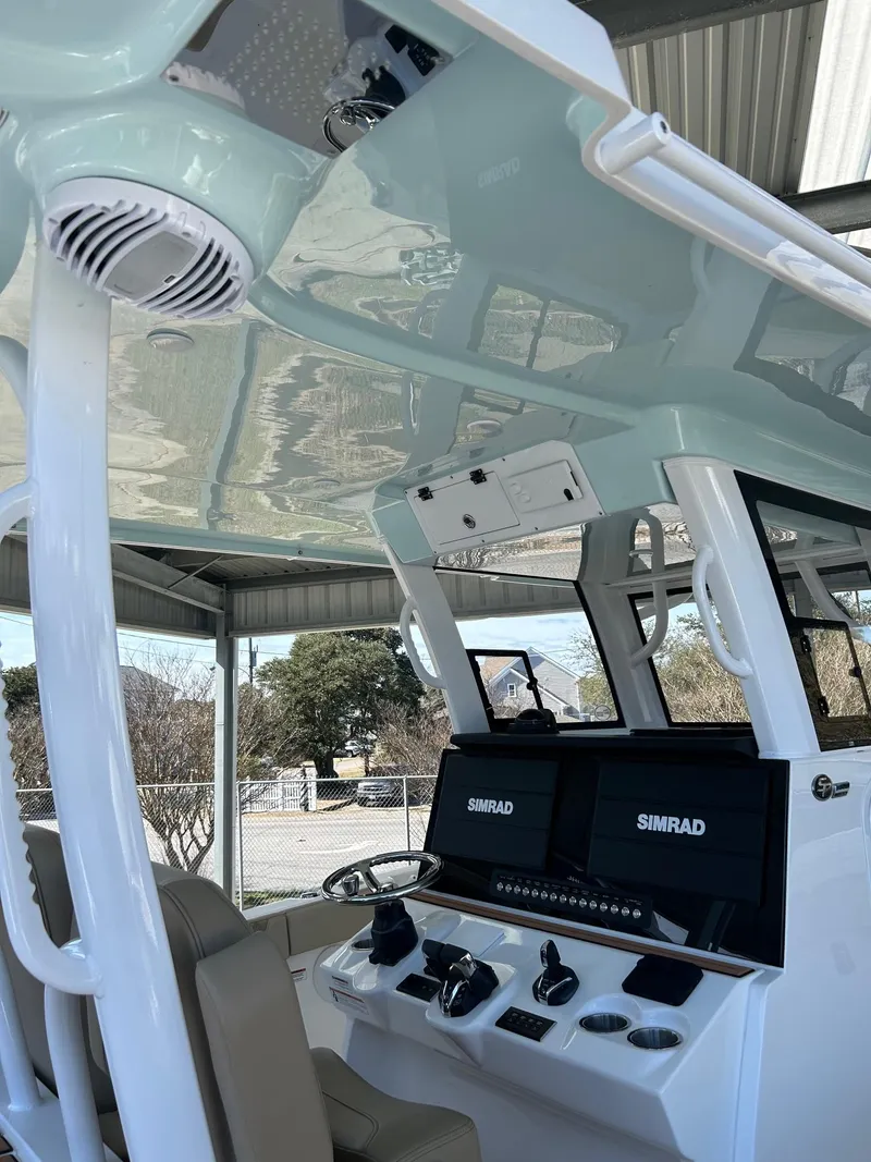 Slide: The Image of 2024 Sea Pro 322 Offshore boat helm with Simrad electronics. - 25