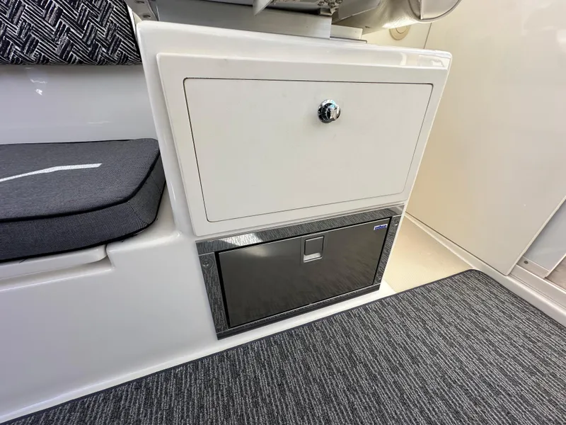 Slide: The Image of Interior storage and seating area of 2016 Marlow Pilot 31 boat. - 13