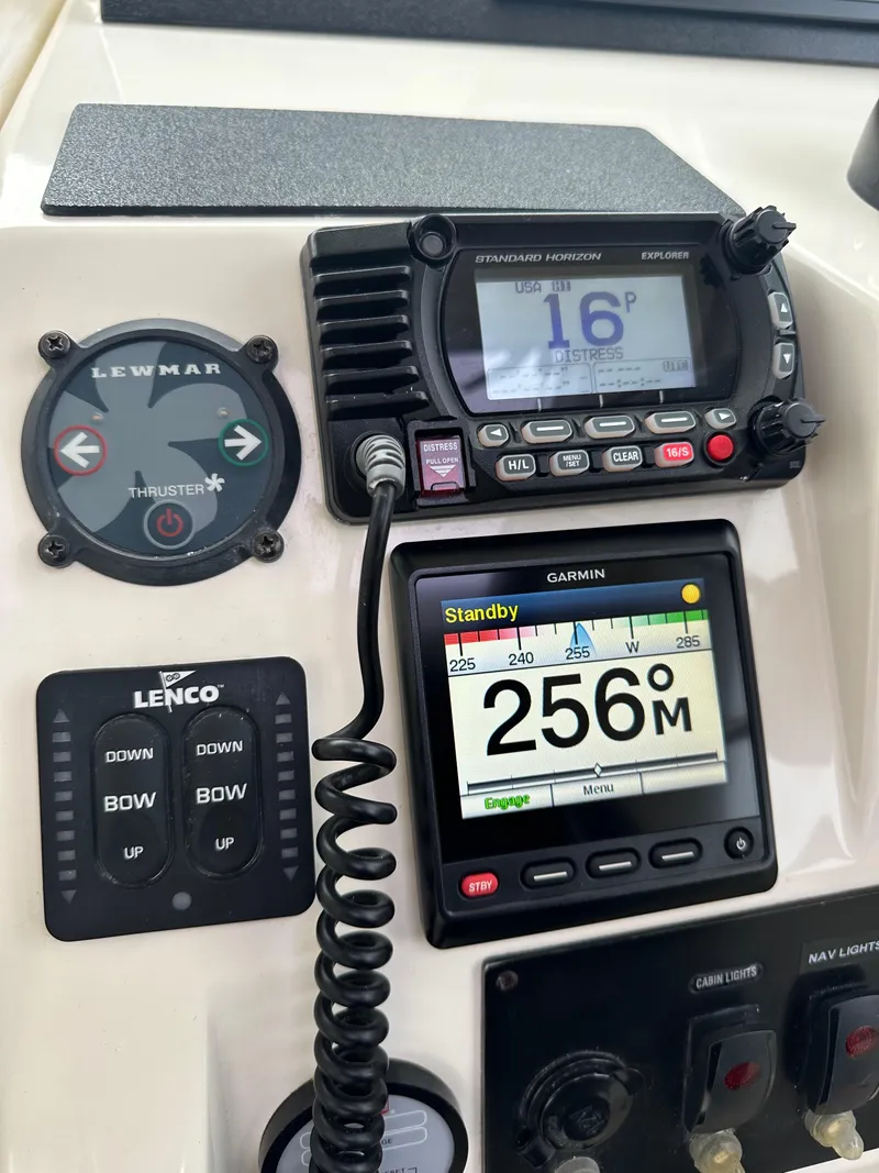 Slide: The Image of Control panel of a 2016 Marlow Pilot 31 boat with navigation instruments. - 17