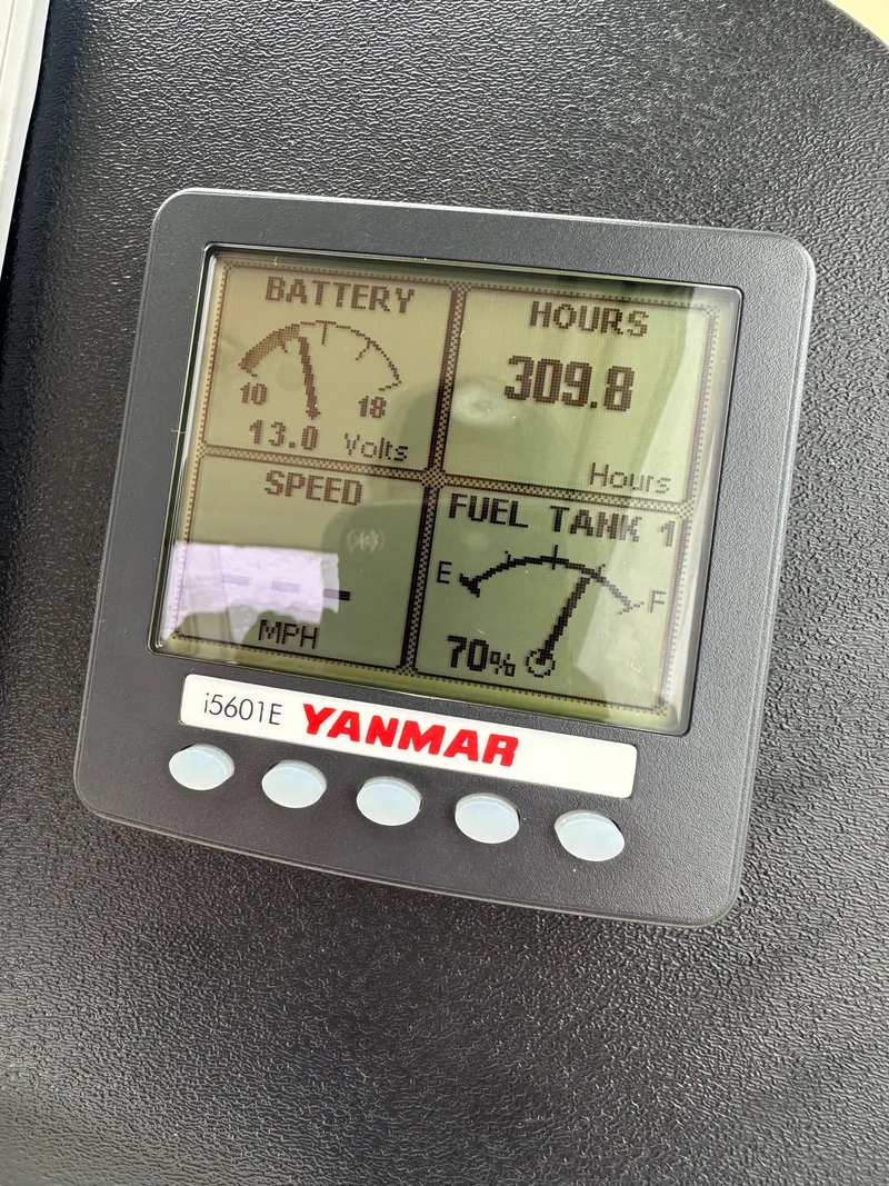 Slide: The Image of Yanmar i5601E display on 2016 Marlow Pilot 31 showing battery, hours, speed, and fuel tank levels. - 18