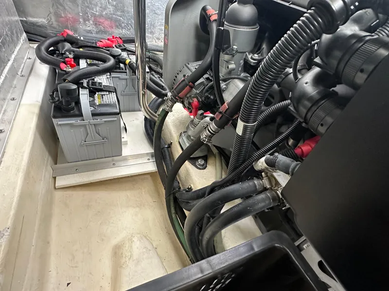 Slide: The Image of Engine compartment of a 2016 Marlow Pilot 31 boat with batteries and wiring. - 30