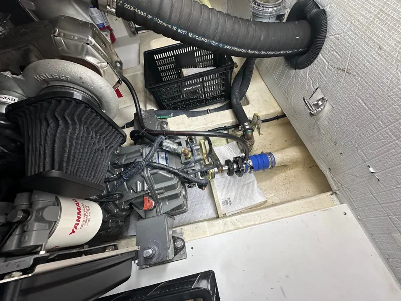 Slide: The Image of Engine compartment of a 2016 Marlow Pilot 31 boat showing mechanical components. - 31