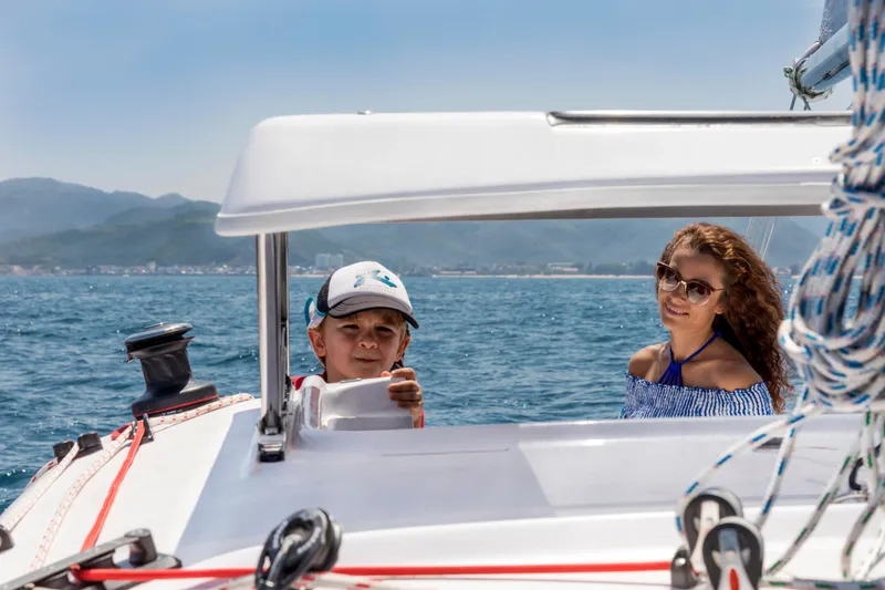 Slide: The Image of People enjoying a sunny day on a Corsair 760 sailboat, 2026 model, at sea. - 21