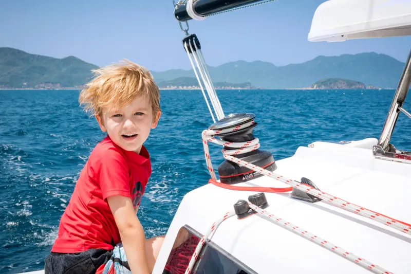 Slide: The Image of Young boy on Corsair 760 sailboat, enjoying sunny day at sea, 2026. - 26