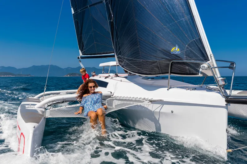 Slide: The Image of Sailing on a 2026 Corsair 760 trimaran in clear blue waters, under sunny skies. - 29