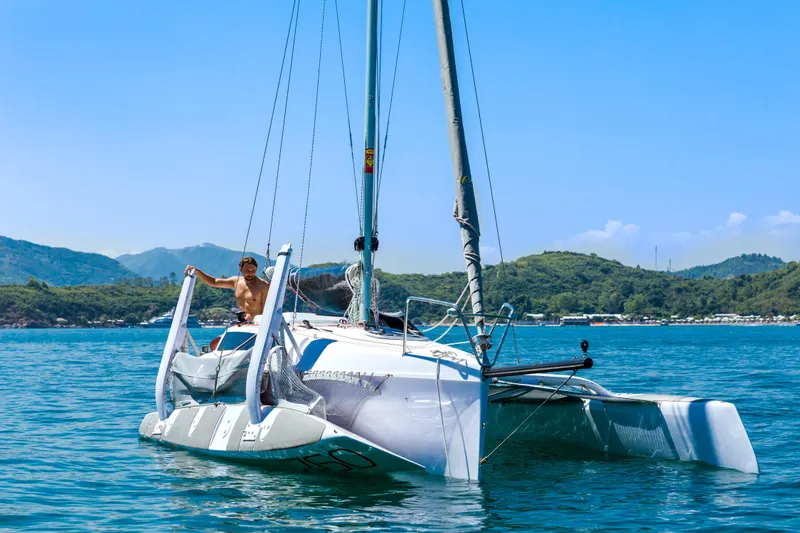 Slide: The Image of Sailor on Corsair 760 trimaran in scenic waters, 2026 model. - 42