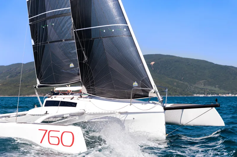 Slide: The Image of Sleek Corsair 760 sailboat gliding on blue waters, 2026 model. - 44
