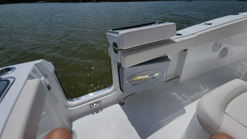 Slide: The Image of 2023 Sea Hunt Gamefish 27 boat interior with open side door. - 10