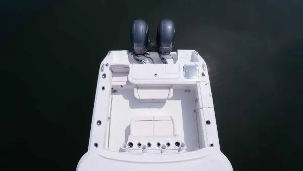 Slide: The Image of 2023 Sea Hunt Gamefish 27 boat with dual outboard motors, aerial view. - 16