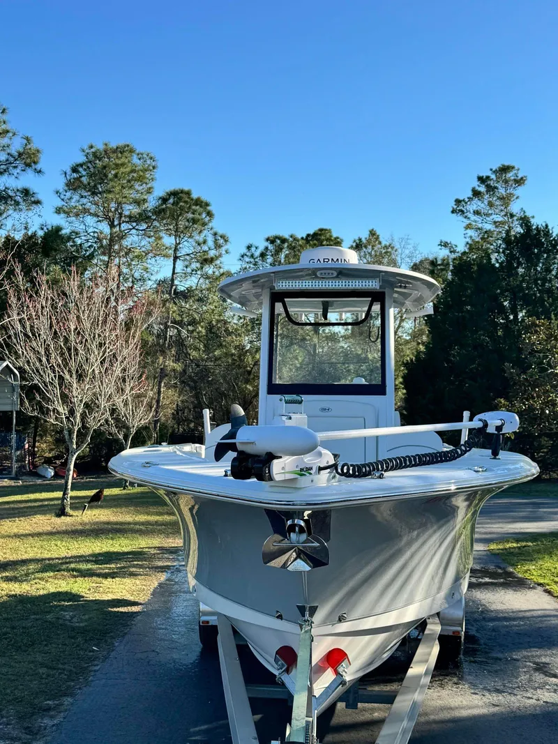 Slide: The Image of 2023 Sea Hunt Gamefish 27 boat on trailer in a driveway. - 17