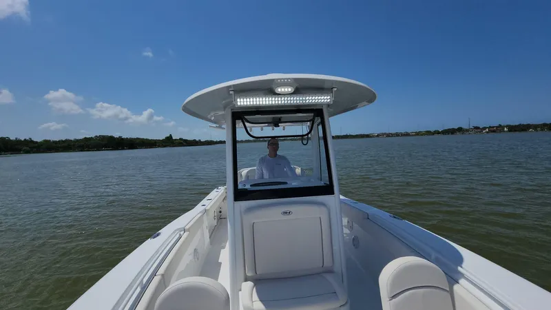 Slide: The Image of 2023 Sea Hunt Gamefish 27 boat cruising on a sunny day. - 22