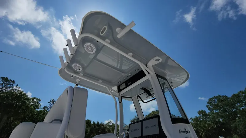 Slide: The Image of 2023 Sea Hunt Gamefish 27 boat with T-top and rod holders. - 25