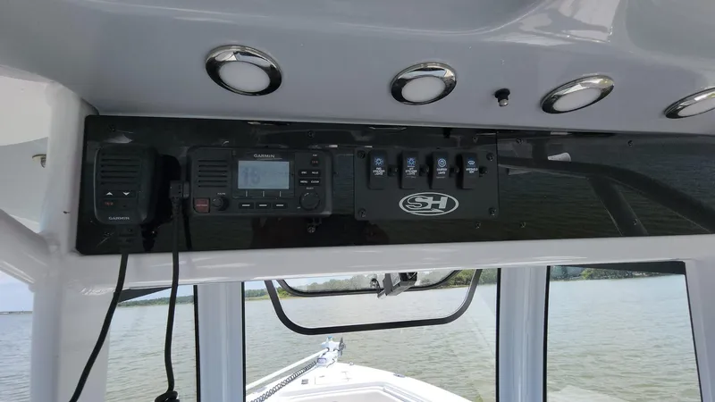 Slide: The Image of Control panel of a 2023 Sea Hunt Gamefish 27 boat with electronic equipment. - 31