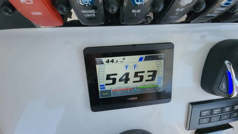 Slide: The Image of 2023 Sea Hunt Gamefish 27 dashboard with Yamaha display and control panel. - 32