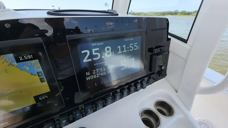 Slide: The Image of 2023 Sea Hunt Gamefish 27 dashboard with GPS and navigation display. - 33
