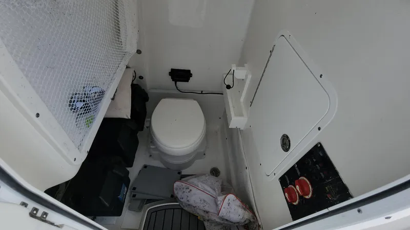 Slide: The Image of 2023 Sea Hunt Gamefish 27 boat interior with toilet and storage. - 34