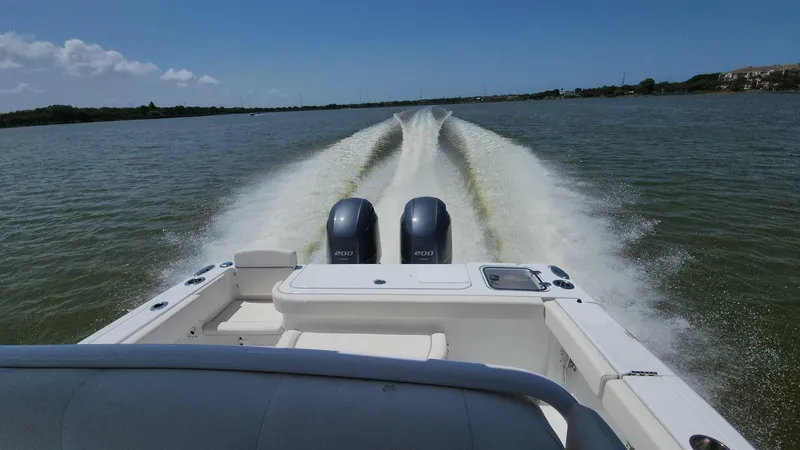 Slide: The Image of 2023 Sea Hunt Gamefish 27 boat cruising on open water. - 4