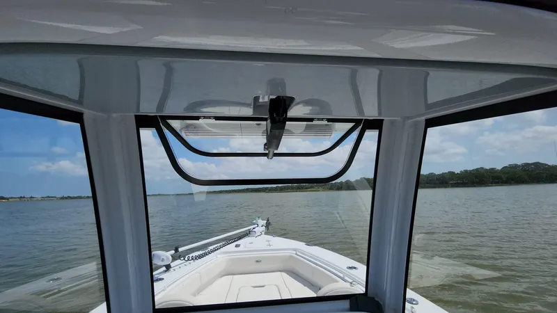 Slide: The Image of View from the helm of a 2023 Sea Hunt Gamefish 27 boat on the water. - 42