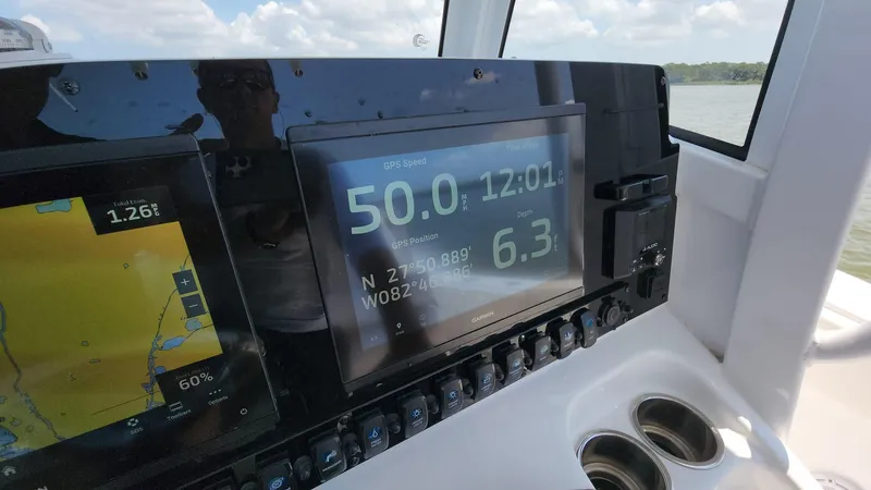 Slide: The Image of Sea Hunt Gamefish 27 dashboard with GPS and navigation displays, 2023 model. - 43