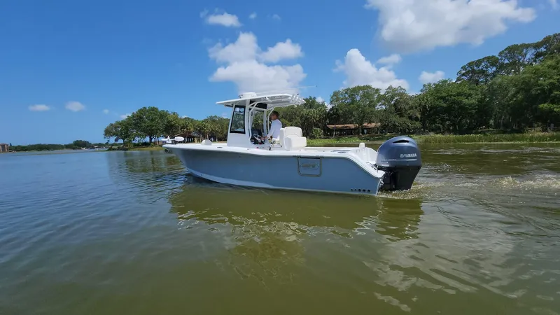 Slide: The Image of 2023 Sea Hunt Gamefish 27 boat cruising on a sunny day. - 44