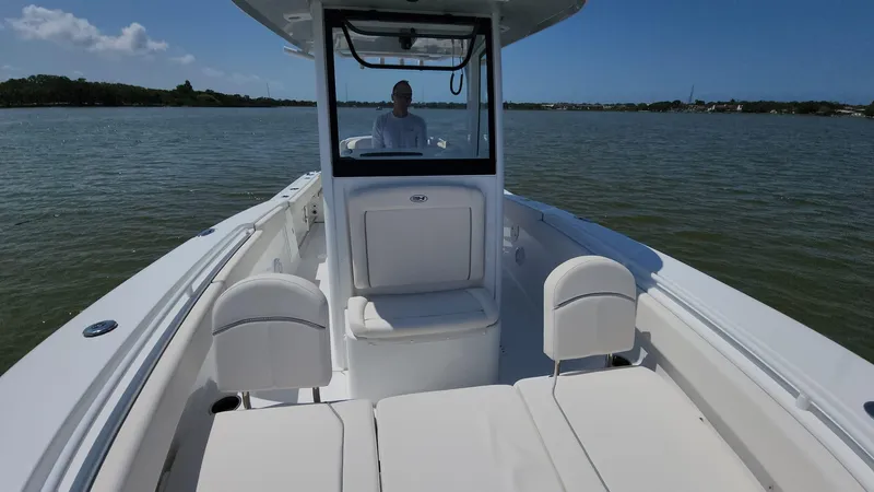 Slide: The Image of 2023 Sea Hunt Gamefish 27 boat on calm waters. - 49