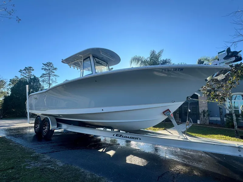 Slide: The Image of 2023 Sea Hunt Gamefish 27 boat on EZ Loader trailer. - 6
