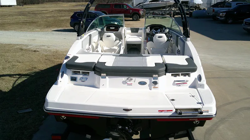Slide: The Image of 2024 Chaparral 23 SSI SPORT boat, rear view, parked outdoors on a sunny day. - 4