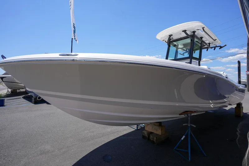 Slide: The Image of 2024 Caymas 281 HB boat on display, side view. - 10