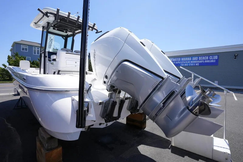 Slide: The Image of 2024 Caymas 281 HB boat with powerful outboard engines on display. - 11