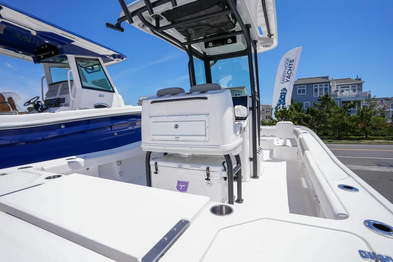 Slide: The Image of 2024 Caymas 281 HB boat interior with seating and storage compartments. - 16