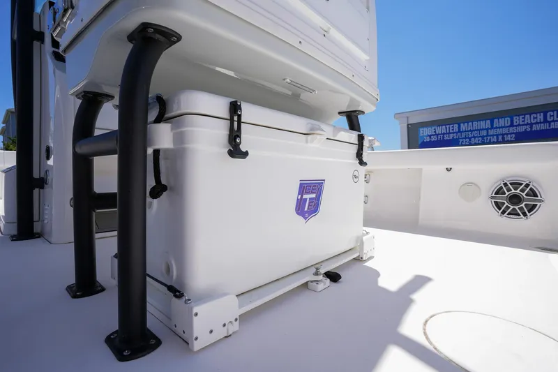 Slide: The Image of Caymas 281 HB 2024 model with cooler on deck at Edgewater Marina. - 17