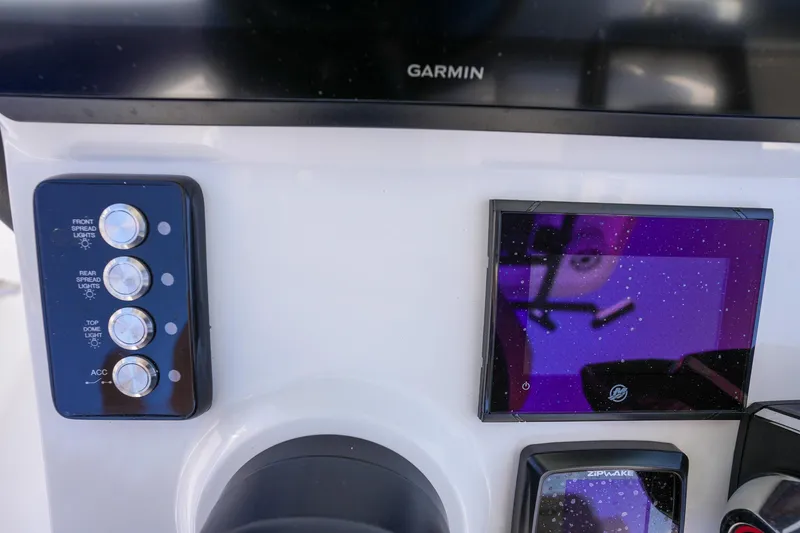 Slide: The Image of Control panel of 2024 Caymas 281 HB boat with Garmin display. - 22