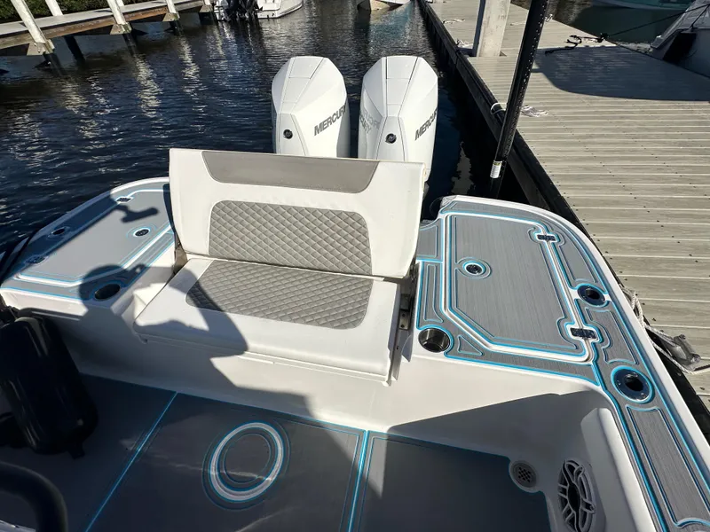 Slide: The Image of 2024 Caymas 281 HB boat with dual Mercury engines at dock. - 5